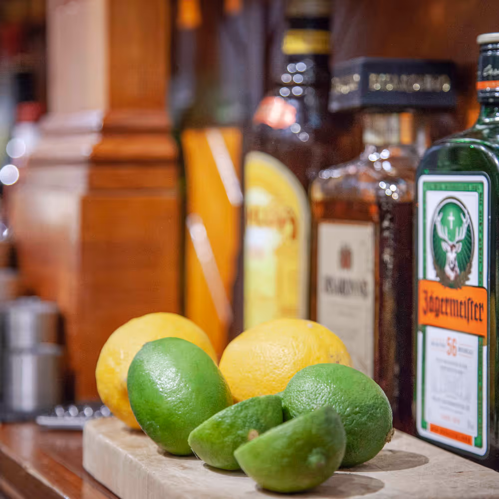 Drinks and citrus fruit on a hotel bar.