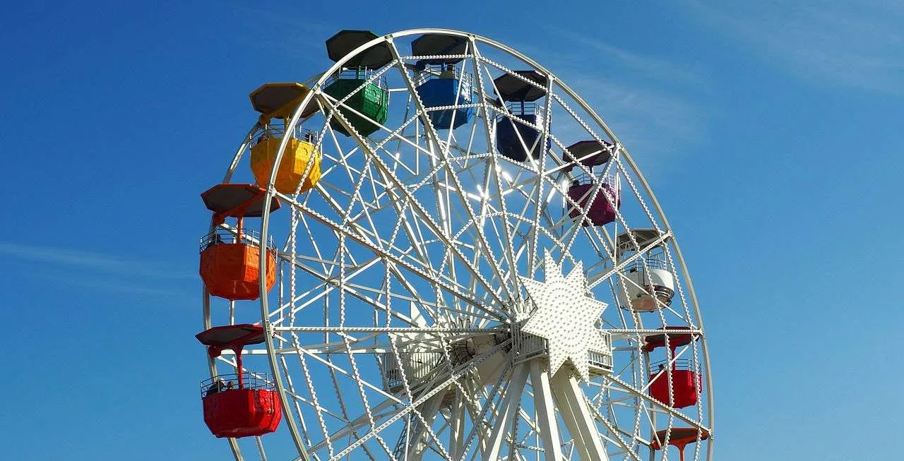A ferris wheel with a lot of colors on it.