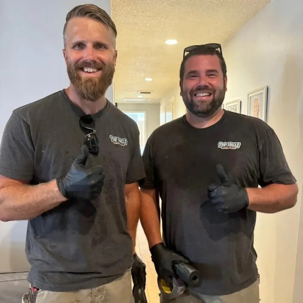 Technician installing a smart thermostat, showcasing professional installation process and expertise
