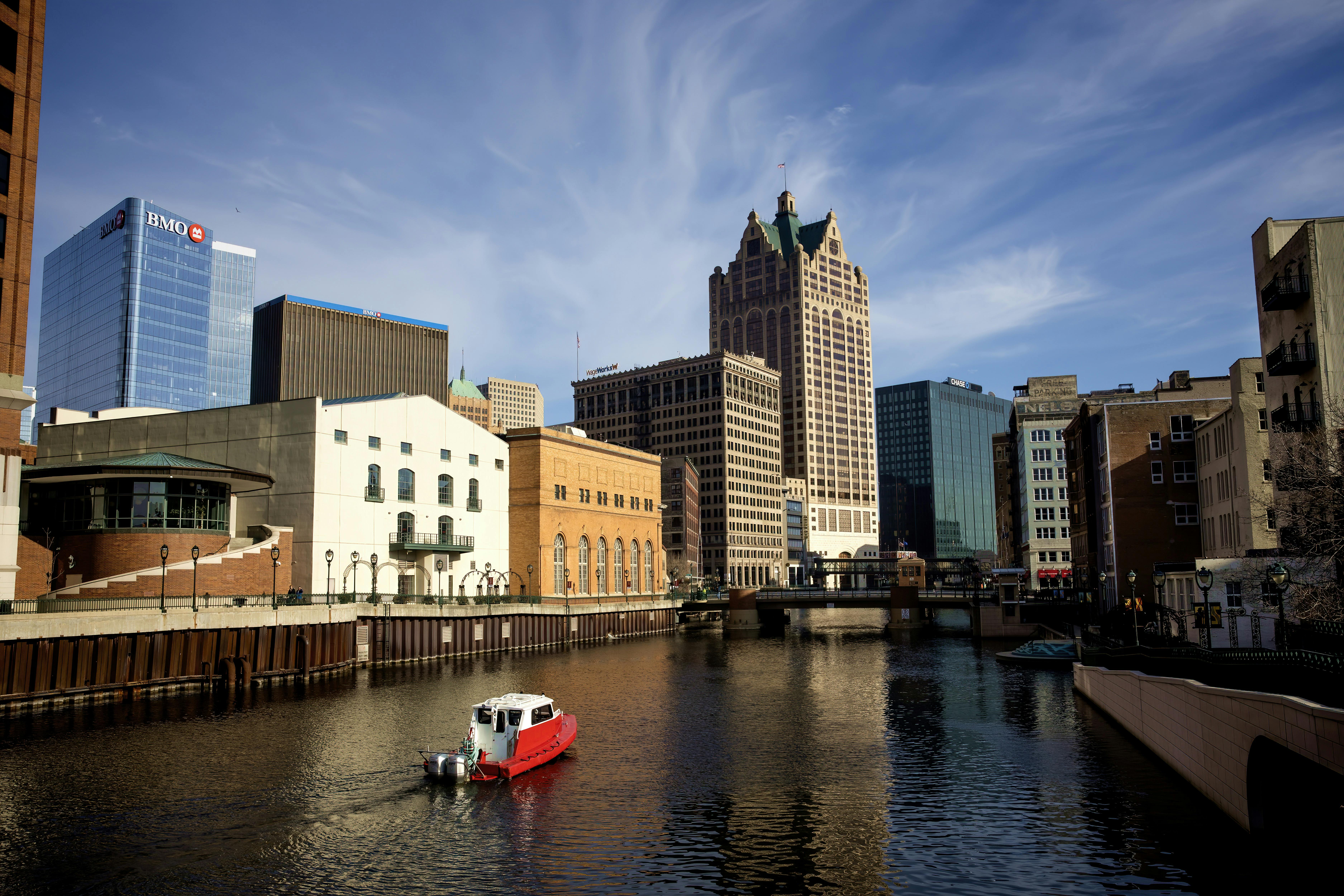 Milwaukee city with river and boat on it