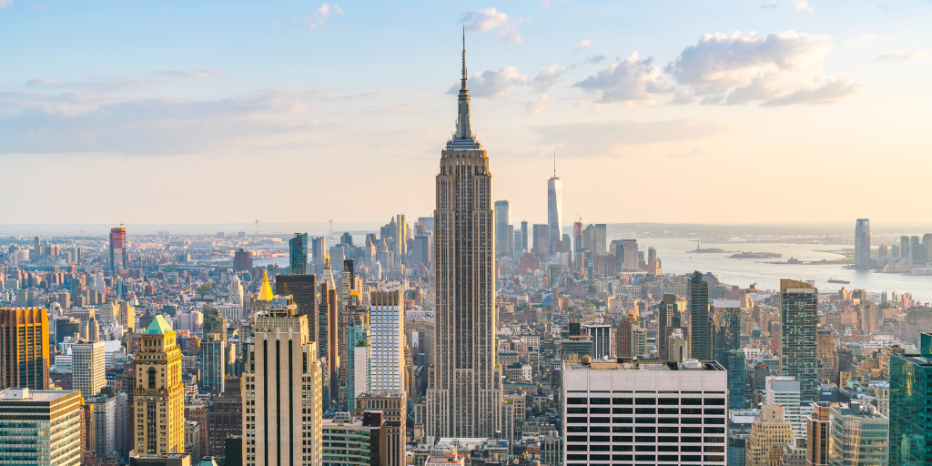 A panoramic view of New York City’s skyline, showing tall buildings and crisp winter light, representing the location of the Neudata Winter Data Summit