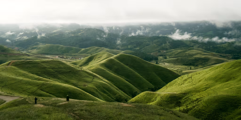 A misty mountain landscape illustrating supply chain visibility challenges and the importance of continuous third-party risk monitoring and OSINT to uncover hidden vendor risks.