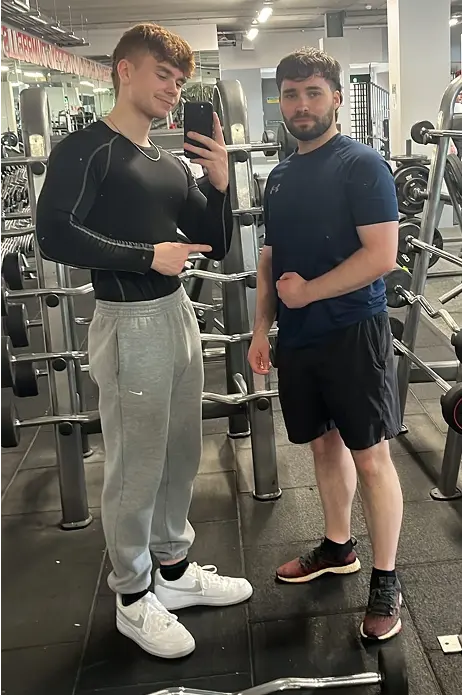 Dylan Barry posing with a personal training client
