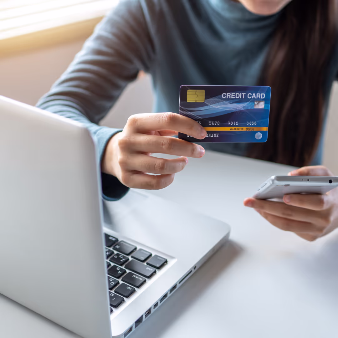 a man displaying a credit card