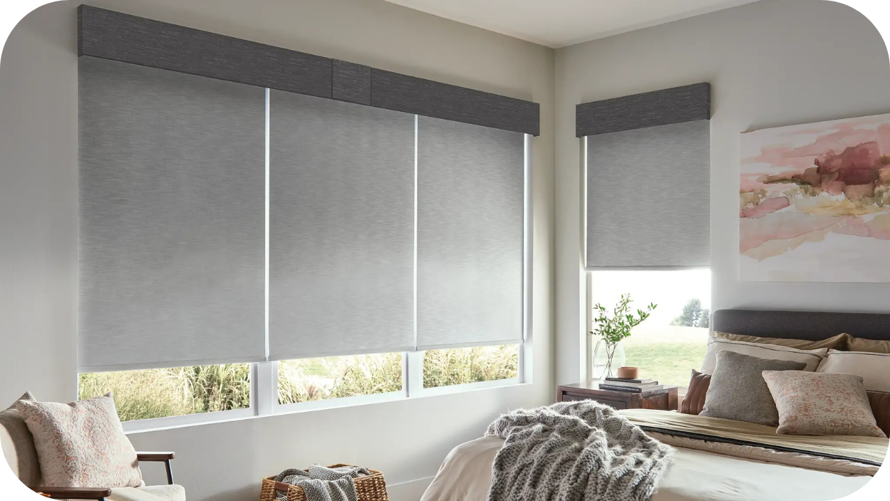 A modern bedroom with automated roller blinds covering large windows, creating a sleek and minimal design while enhancing comfort and privacy.