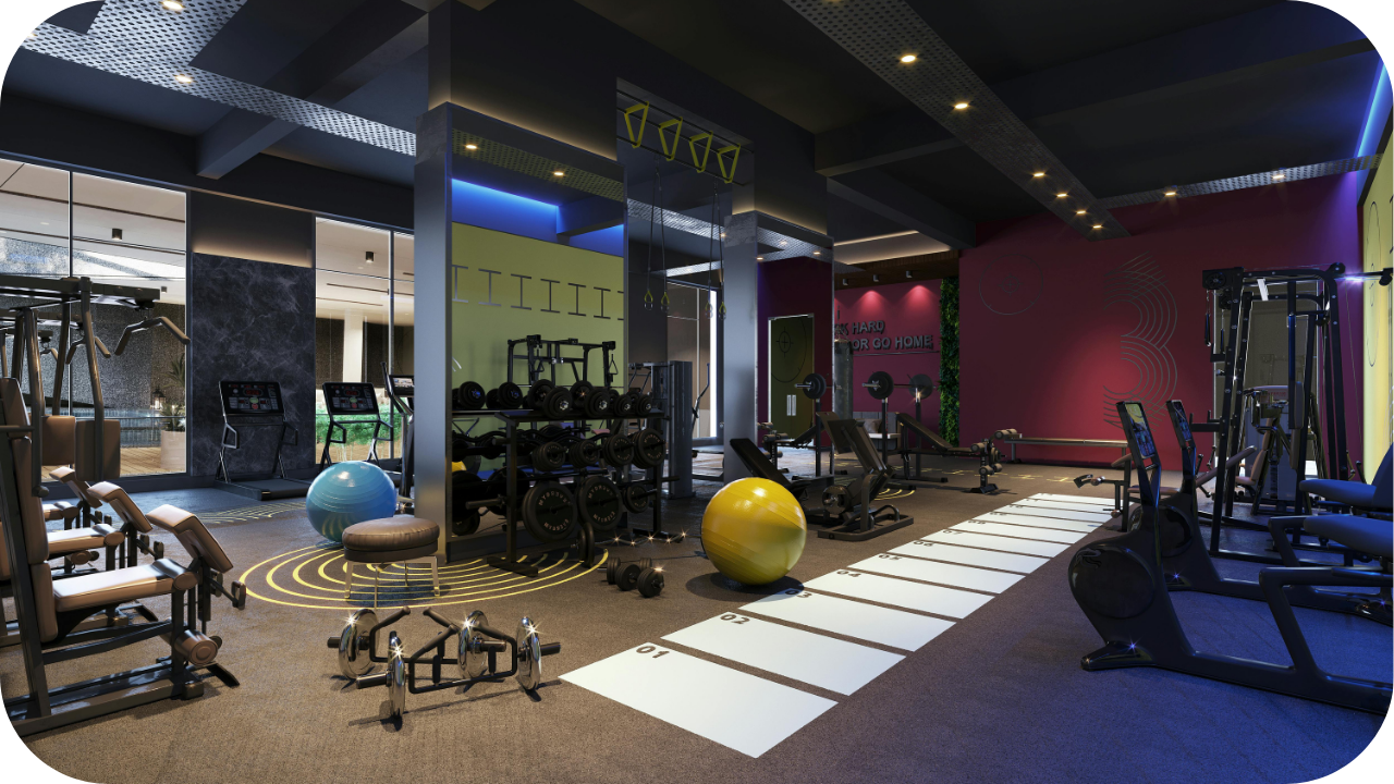 Modern gym interior with exercise machines, free weights, resistance bands, and large fitness balls, featuring colourful walls, bright lighting, and a motivational workout atmosphere.