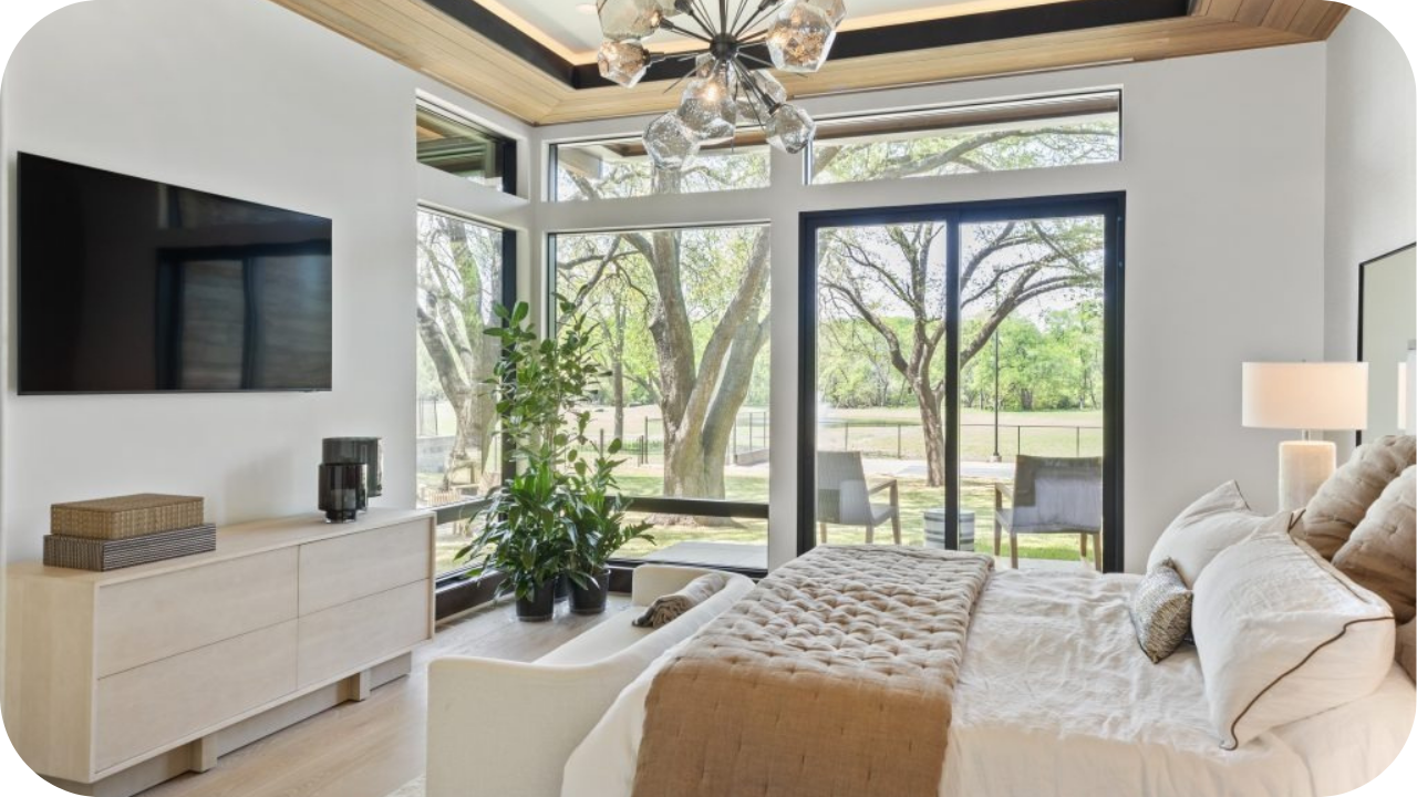 Bedroom interior with large windows, neutral tones, and natural light showcasing elegant modern design in a Melbourne home renovation.
