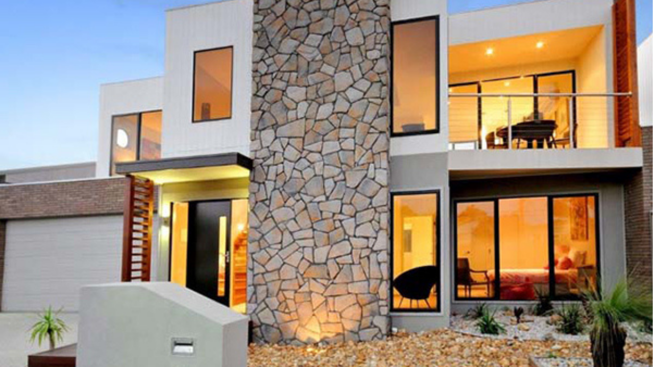Contemporary Australian home with bold stone feature wall, large windows, and modern cladding that showcases premium exterior finishes.