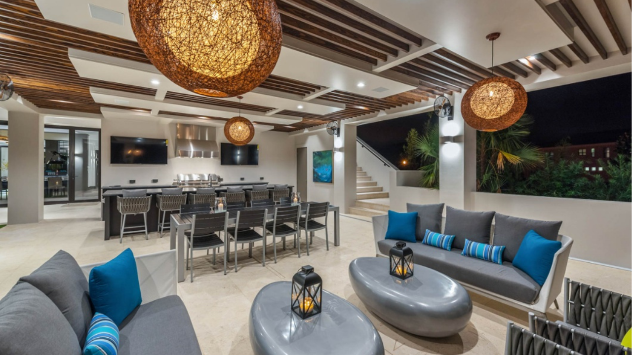 Luxury outdoor living area with modern seating, timber ceiling details and ambient lighting showcasing premium architectural lifestyle features