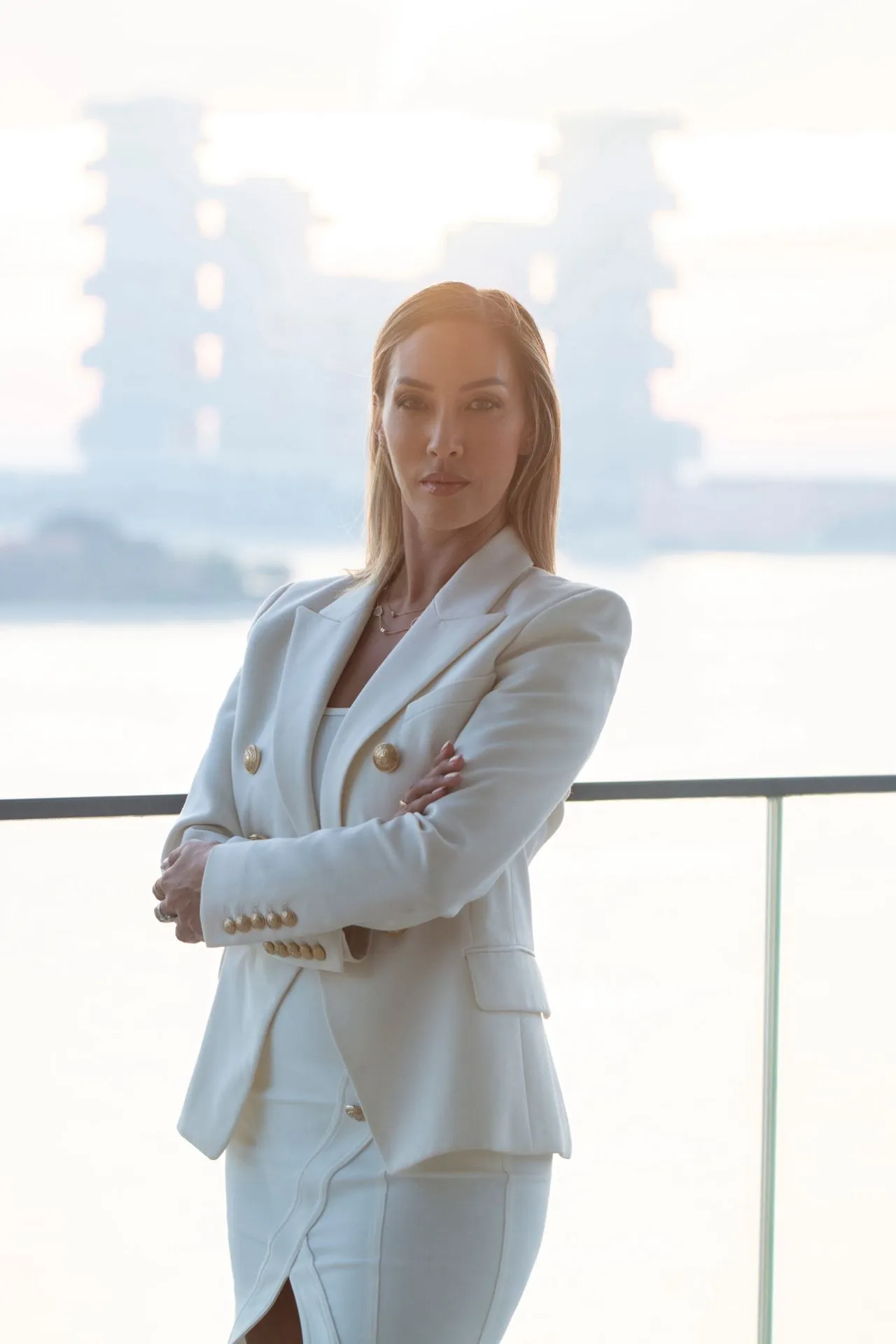 Professional portrait shot of Diamond Truong with the Dubai skyline in the background.