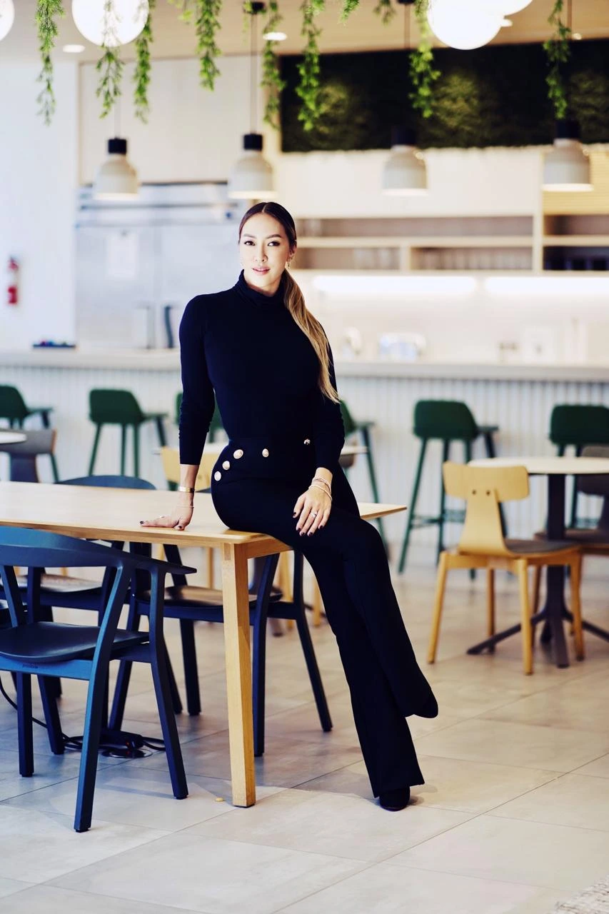 Diamond Truong sitting on the table