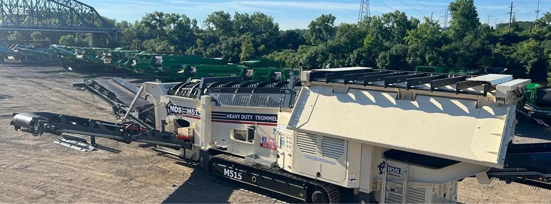 A large machine is parked on the side of the road.