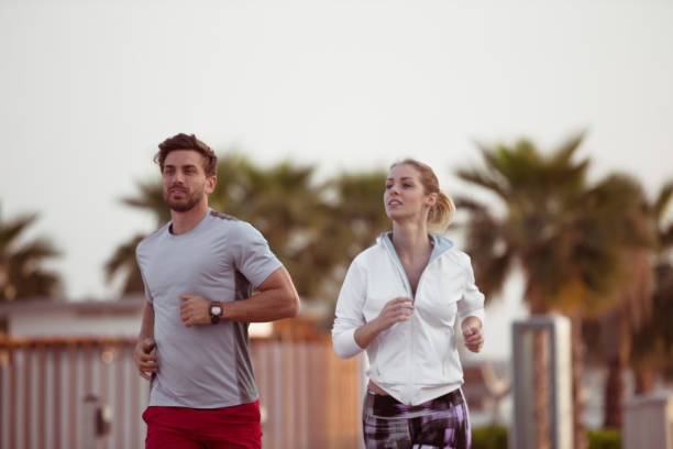 Candid photo of a couple running during training.
