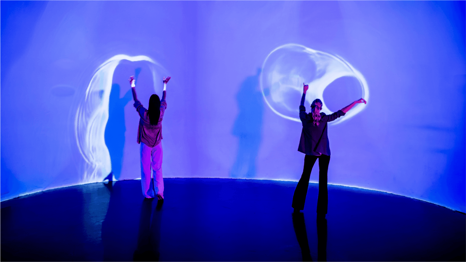 teenagers at INTER NYC interacting with a light wall