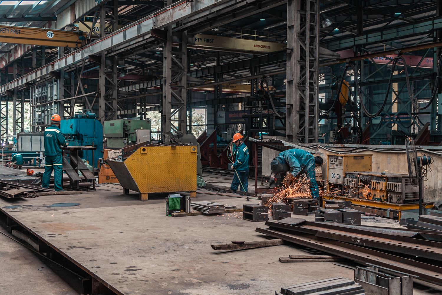 Diverse technicians working together on production equipment in a Georgia manufacturing facility