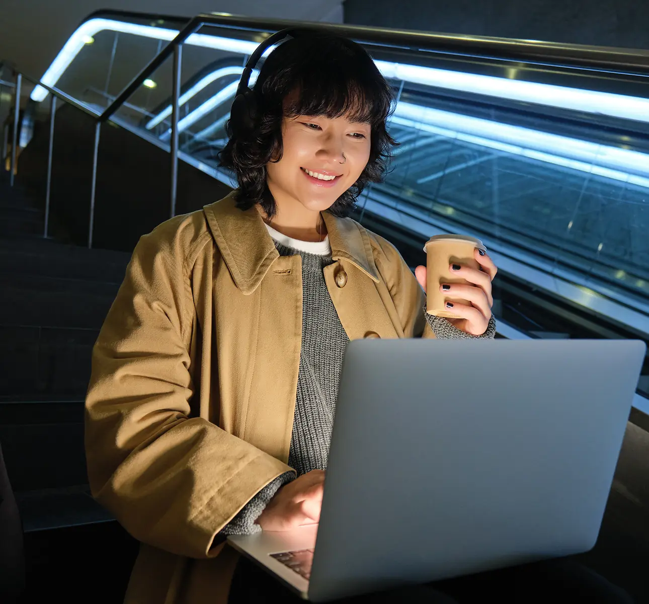 Web3 founder working on her app, posing for media coverage