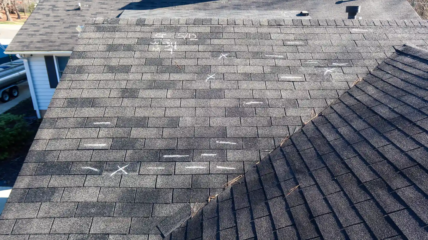 An expert doing a roof inspection in Grand Prairie, TX