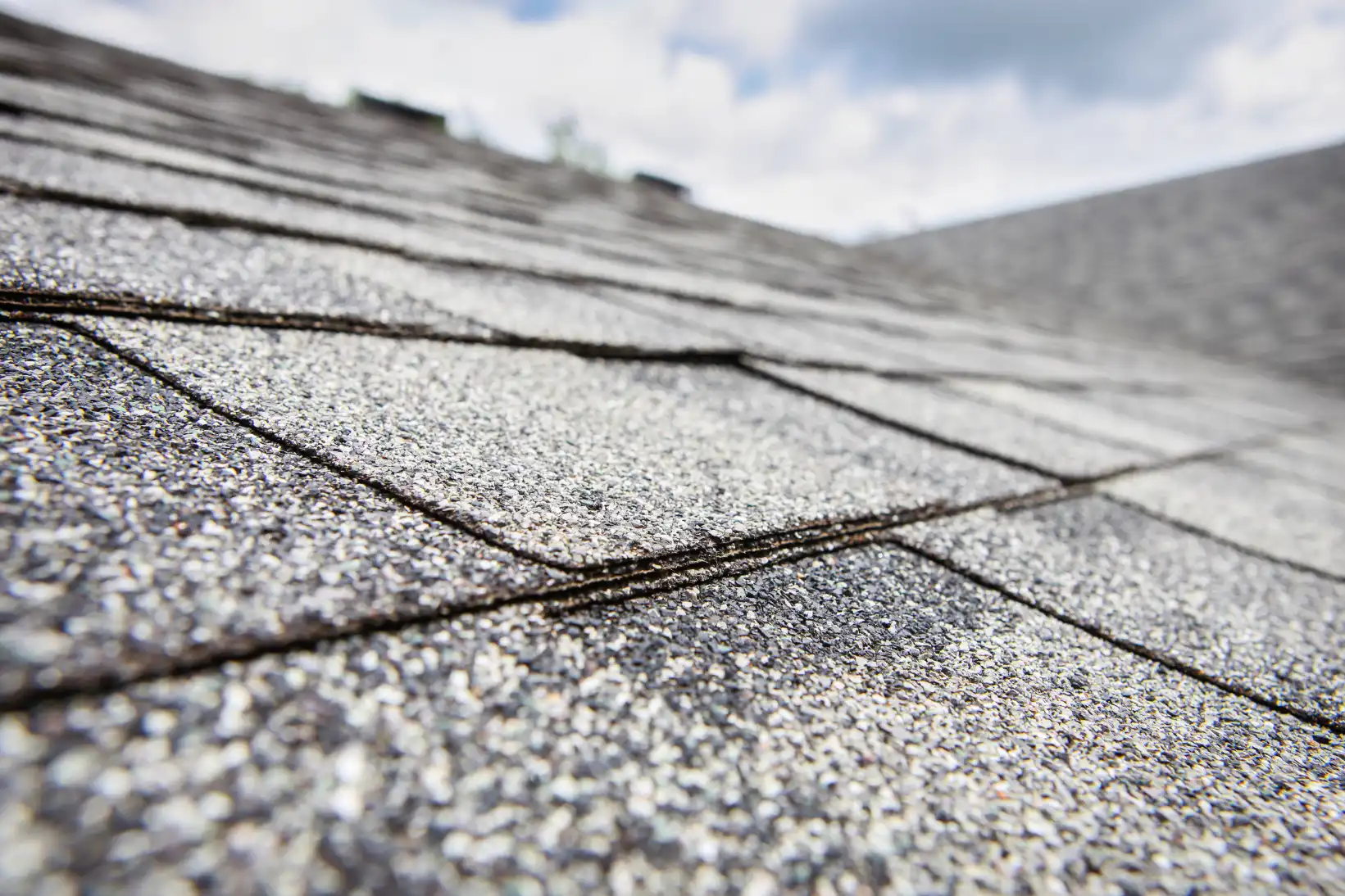 A roofer doing roof maintenance in Irving, TX