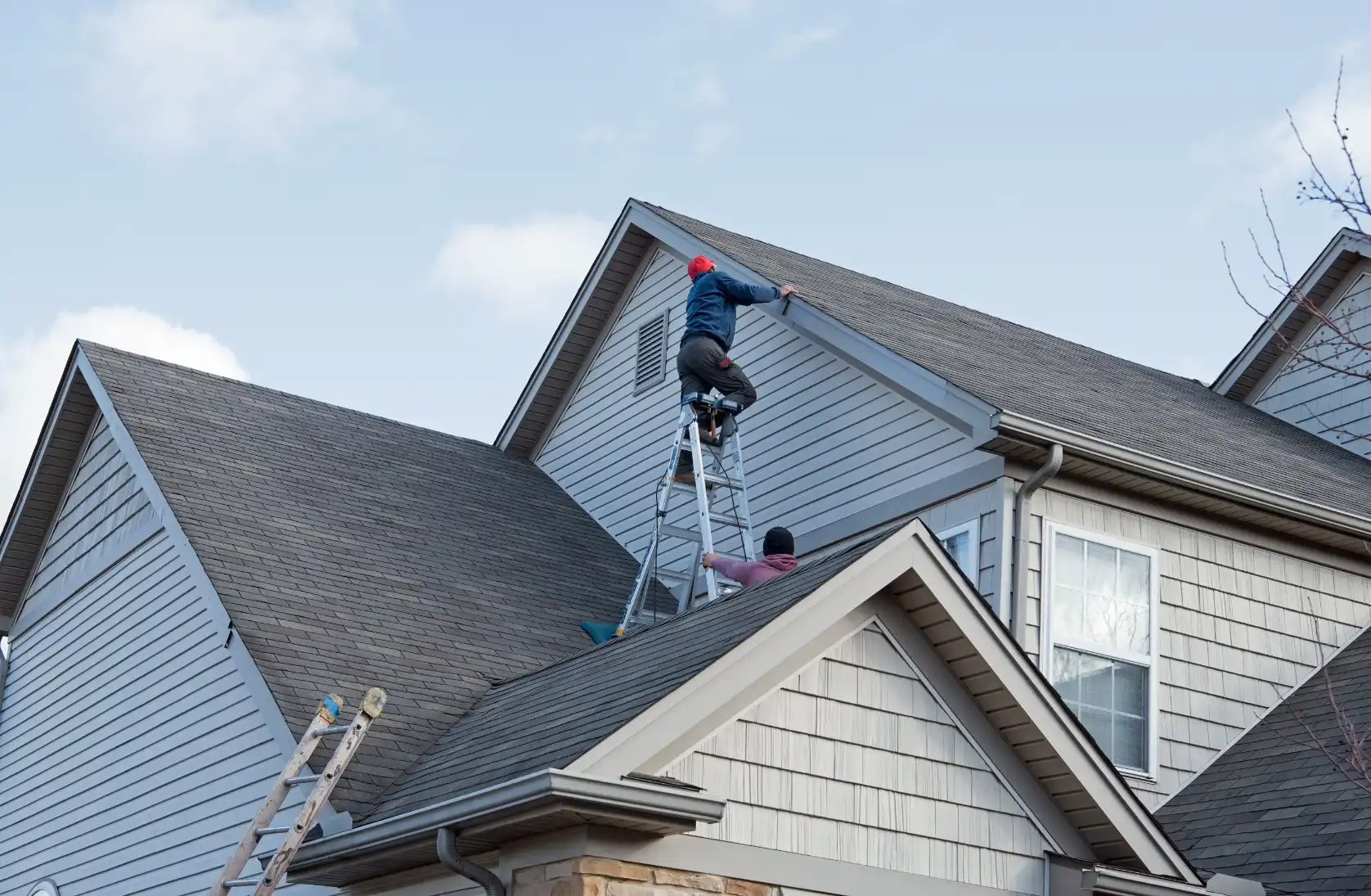 A roofer doing roof maintenance in Irving, TX