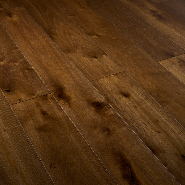 Dark oak hardwood flooring with natural grain and knots in a close-up view.