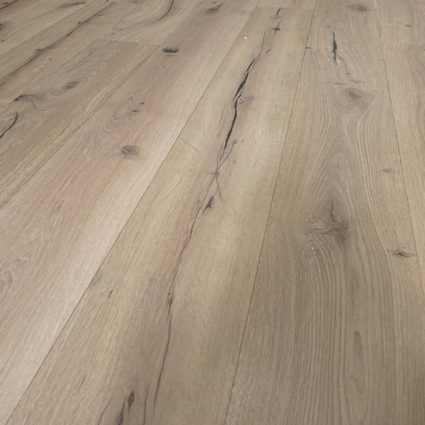 Close-up of light oak wooden floorboards with natural grain and knots.