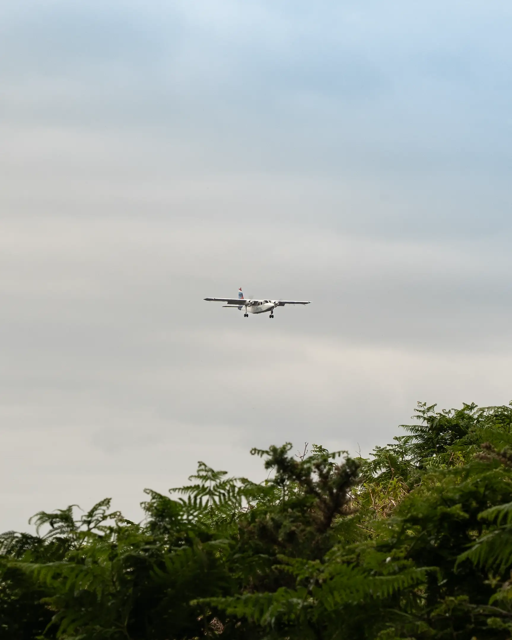 A skybus plane from Isles of Scilly Travel coming into land