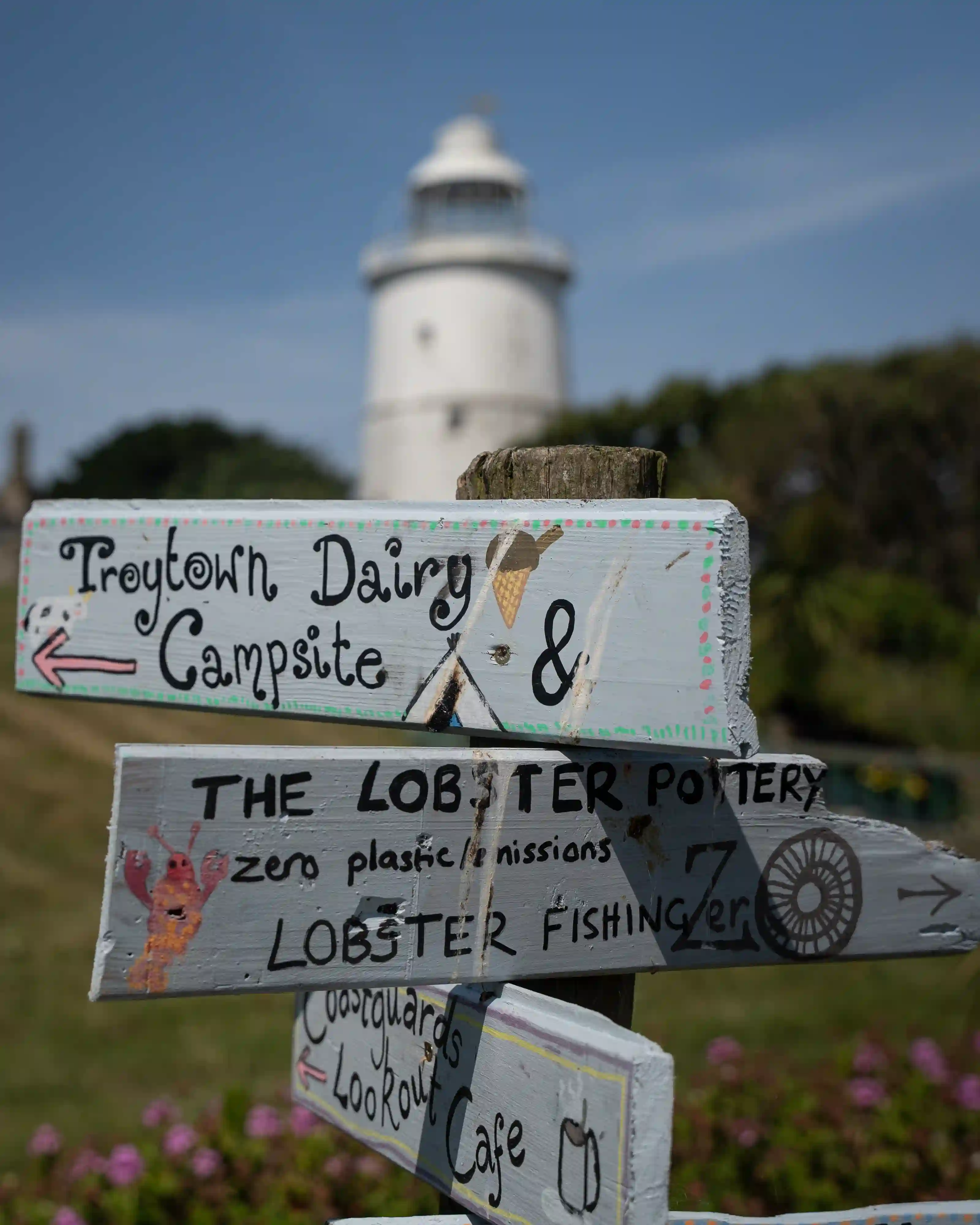 St Agnes Lighthouse with a sign in front