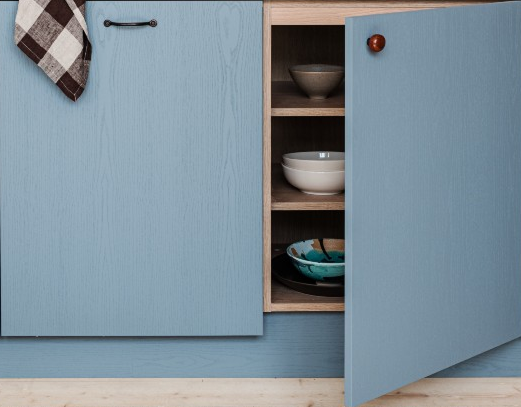 Open blue kitchen cabinet showing interior shelves