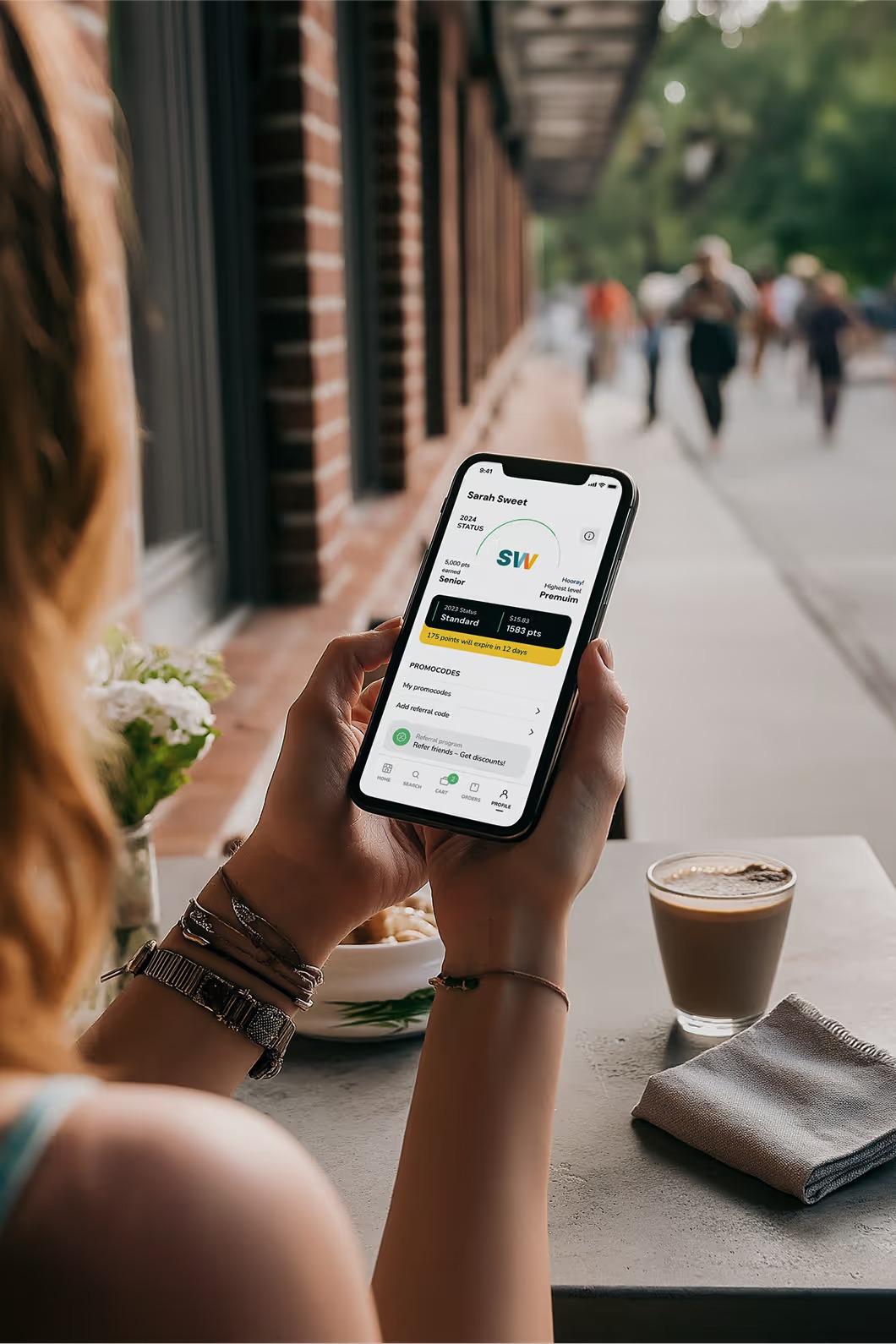 A person’s phone displaying a dispensary’s marketing and loyalty program promotion.