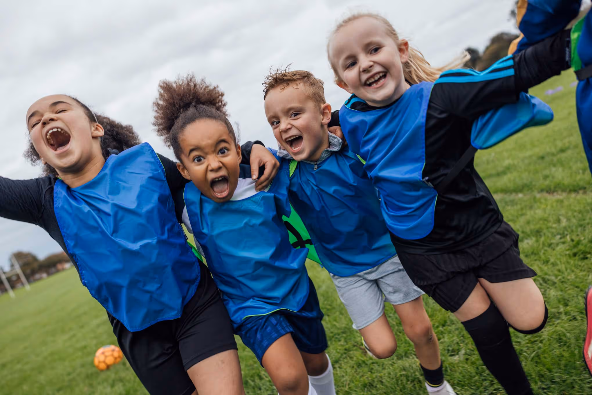 Football playing kids celebrating
