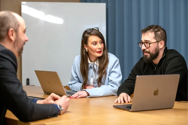 Team meeting with laptops