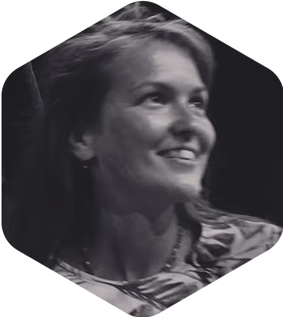 Black and white photo of speaker Irina smiling in profile.