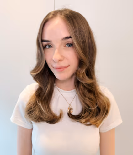 A person styling the Charlotte Haircut