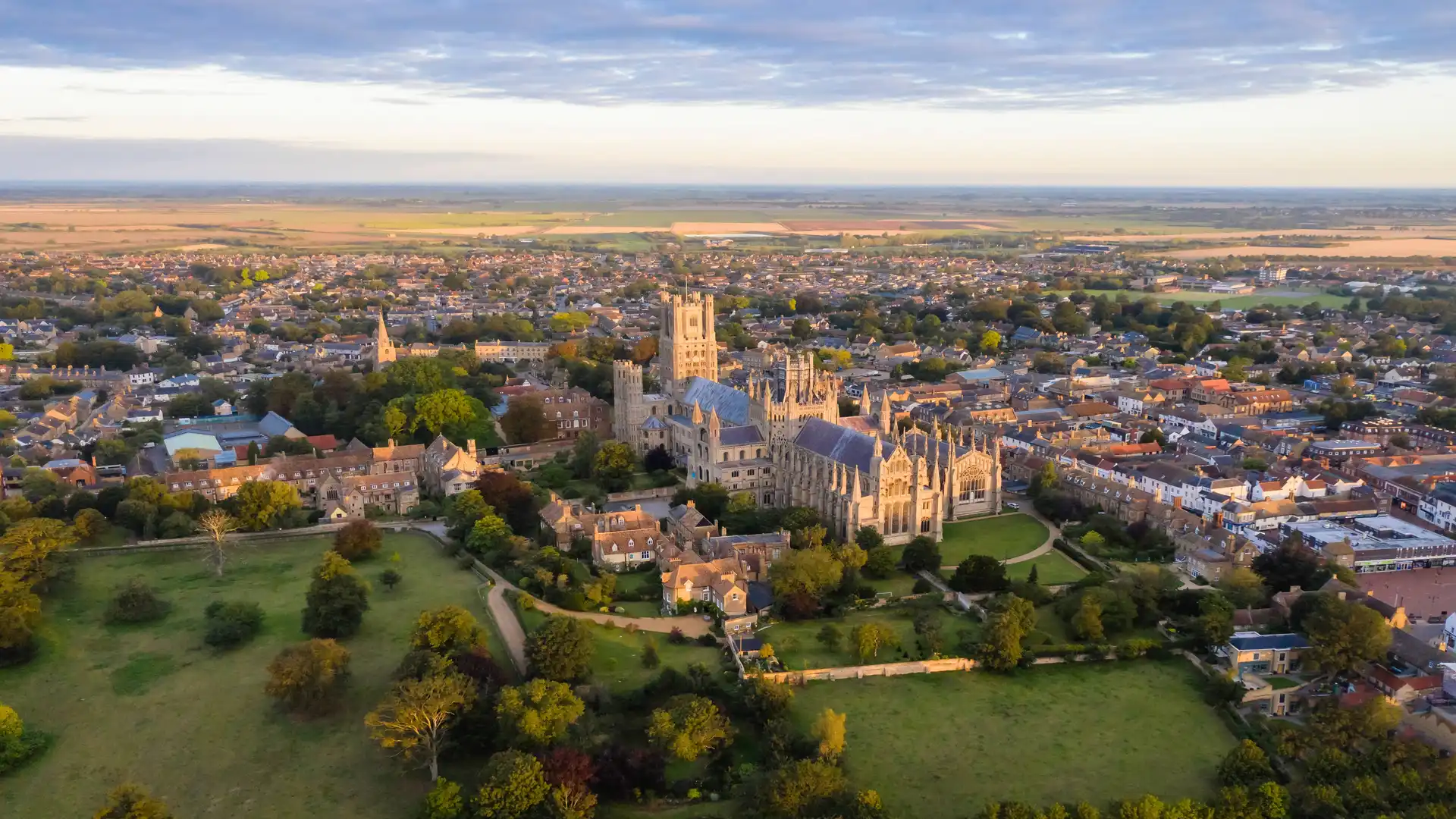 Ariel view of Ely with the cathedral centre and green field surrounding the city.