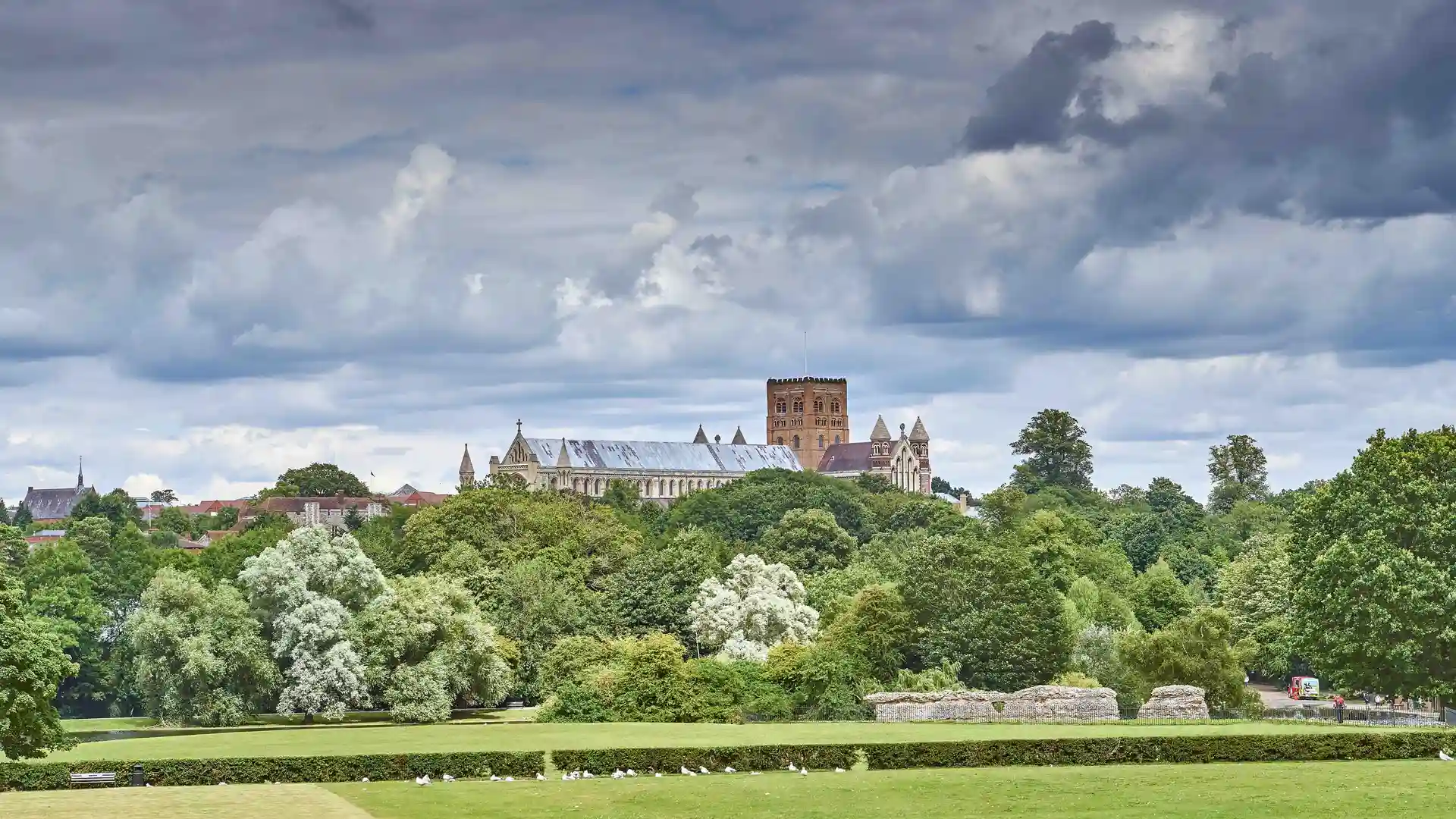 A view across meadows of St Albans Cathedral from Verulam Park in summer.