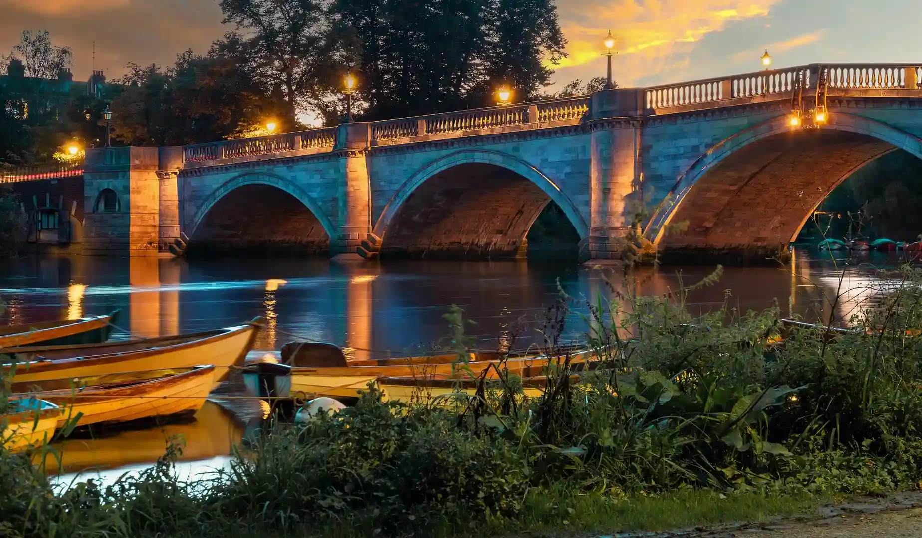 Richmond Upon Thames River illuminated at night in the fall season, in London City, England - United Kingdom