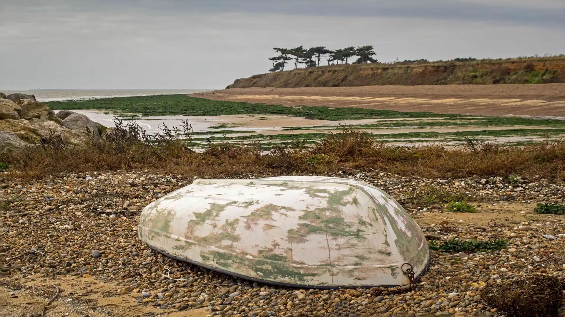 Overturned boat on the coast between bawdsey and shingle street beach suffolk.