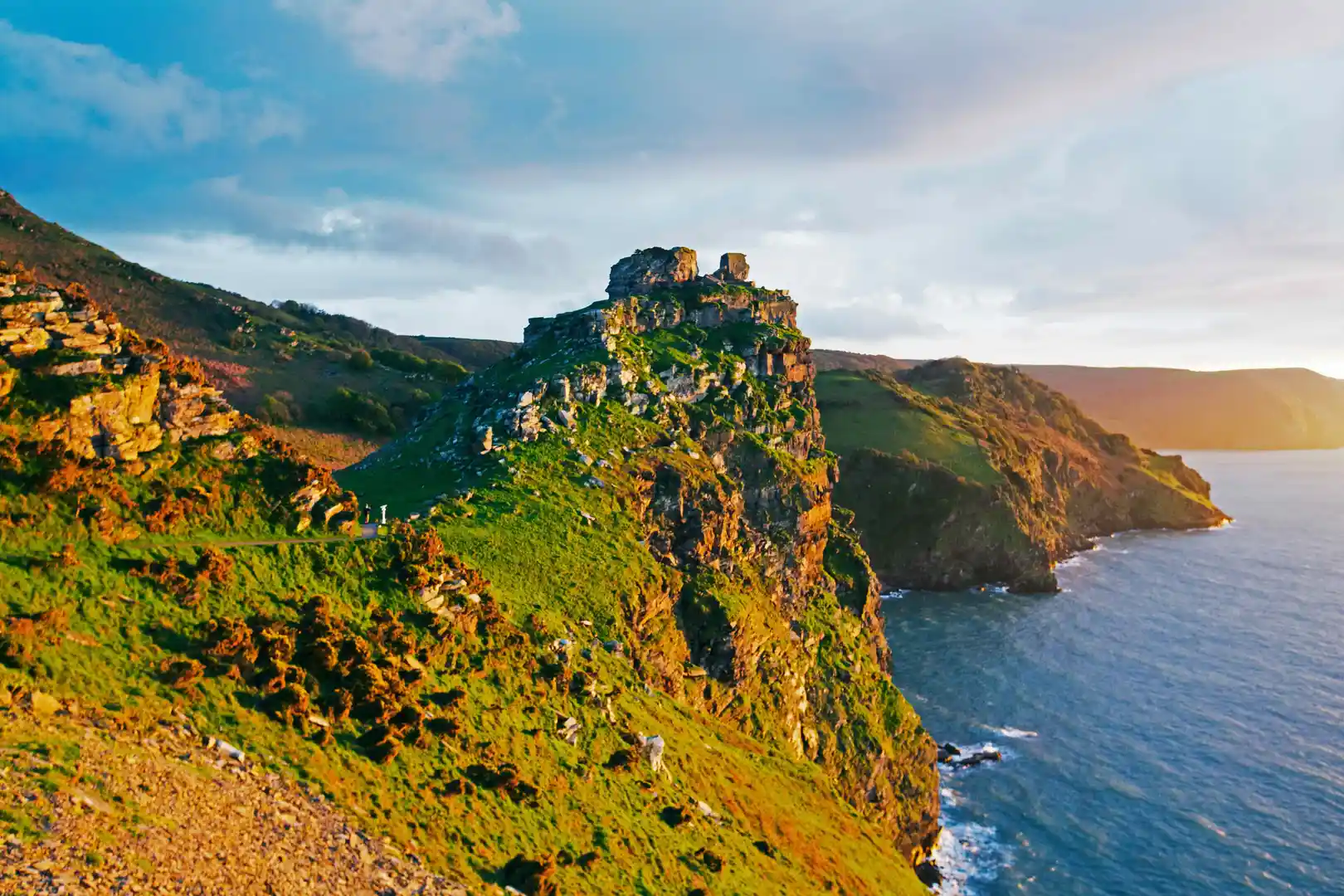 Rugged cliffs and rocky headland at Valley of the Rocks on the North Devon Coast, overlooking the sea at sunset.