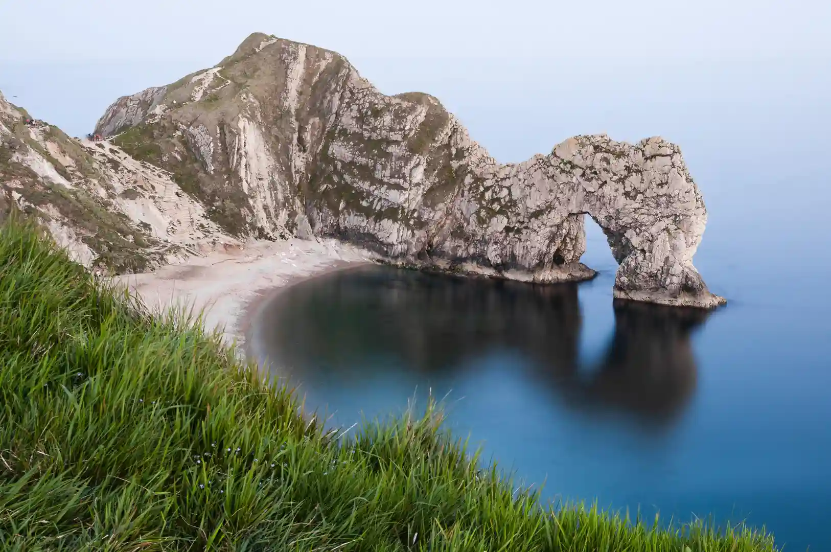 Durdle Door natural limestone arch on the Jurassic Coast in Dorset National Landscape, a famous landmark on the South West Coast Path.