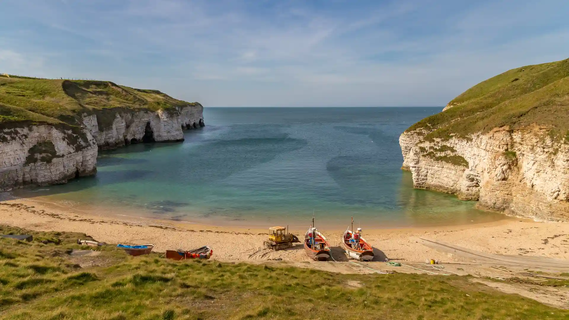 Fishing boats on the beach at Flamborough North Landing near Bridlington, Yorkshire coast section of the England Coast Path.