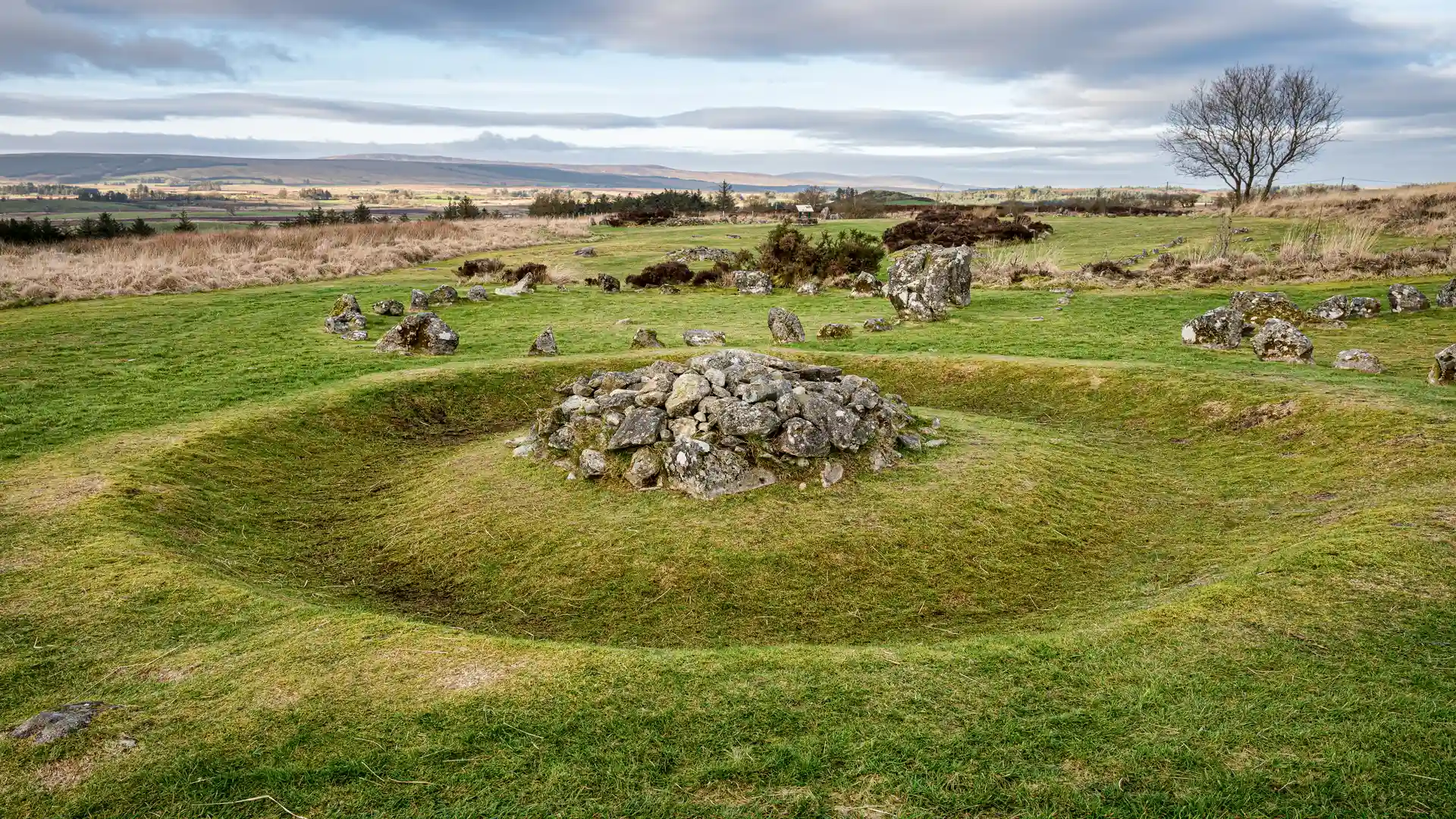 Ancient Beaghmore Stone Circles surrounded by grassy moorland and rolling hills in County Tyrone, Northern Ireland, near Davagh Forest and the Sperrins National Landscape.