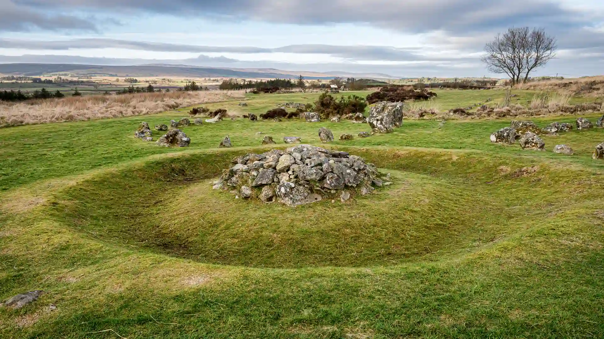Ancient Beaghmore Stone Circles surrounded by grassy moorland and rolling hills in County Tyrone, Northern Ireland, near Davagh Forest and the Sperrins National Landscape.