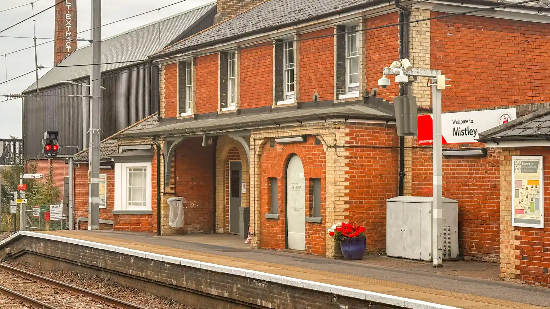 Mistley Station on the East Suffolk Line, a red-brick rural station serving walkers exploring new station-to-station countryside trails across Suffolk and the East of England.