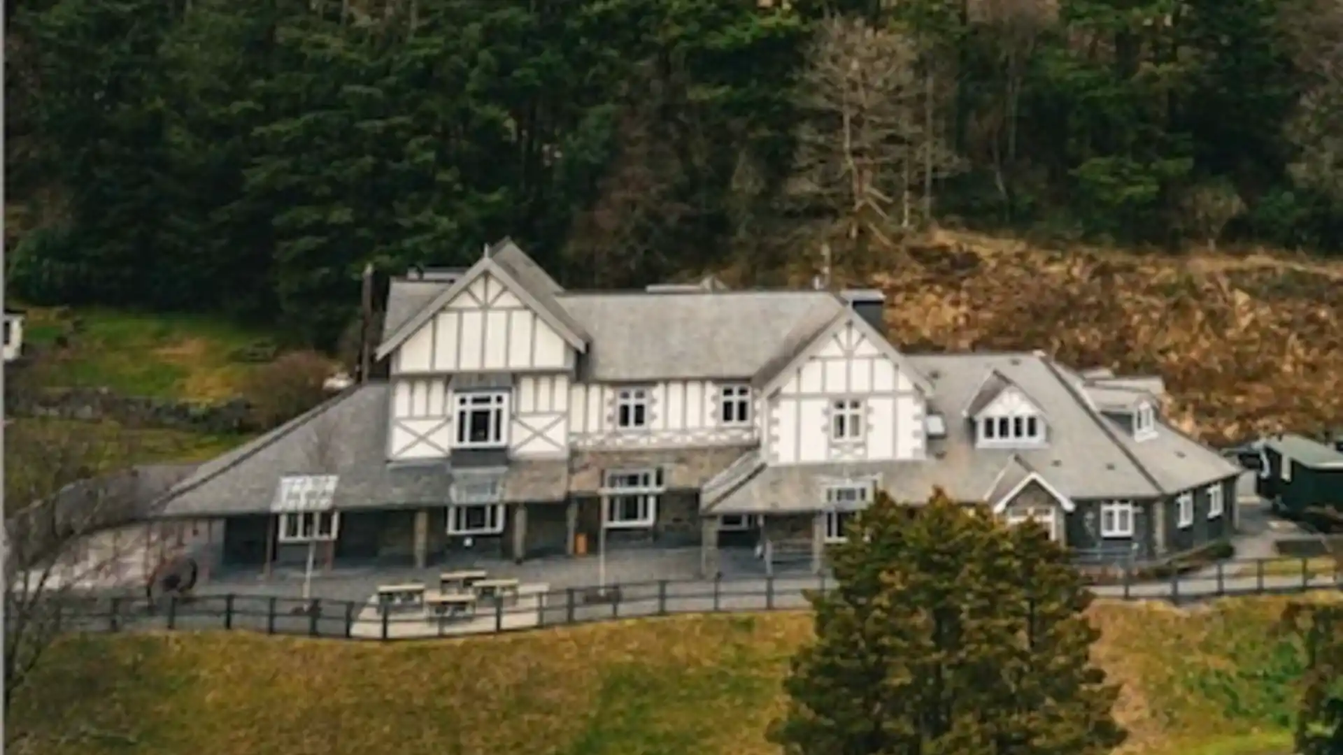 Plas Weunydd Hotel at Blaenau Ffestiniog, set against wooded hillsides in Eryri (Snowdonia) National Park, Wales.