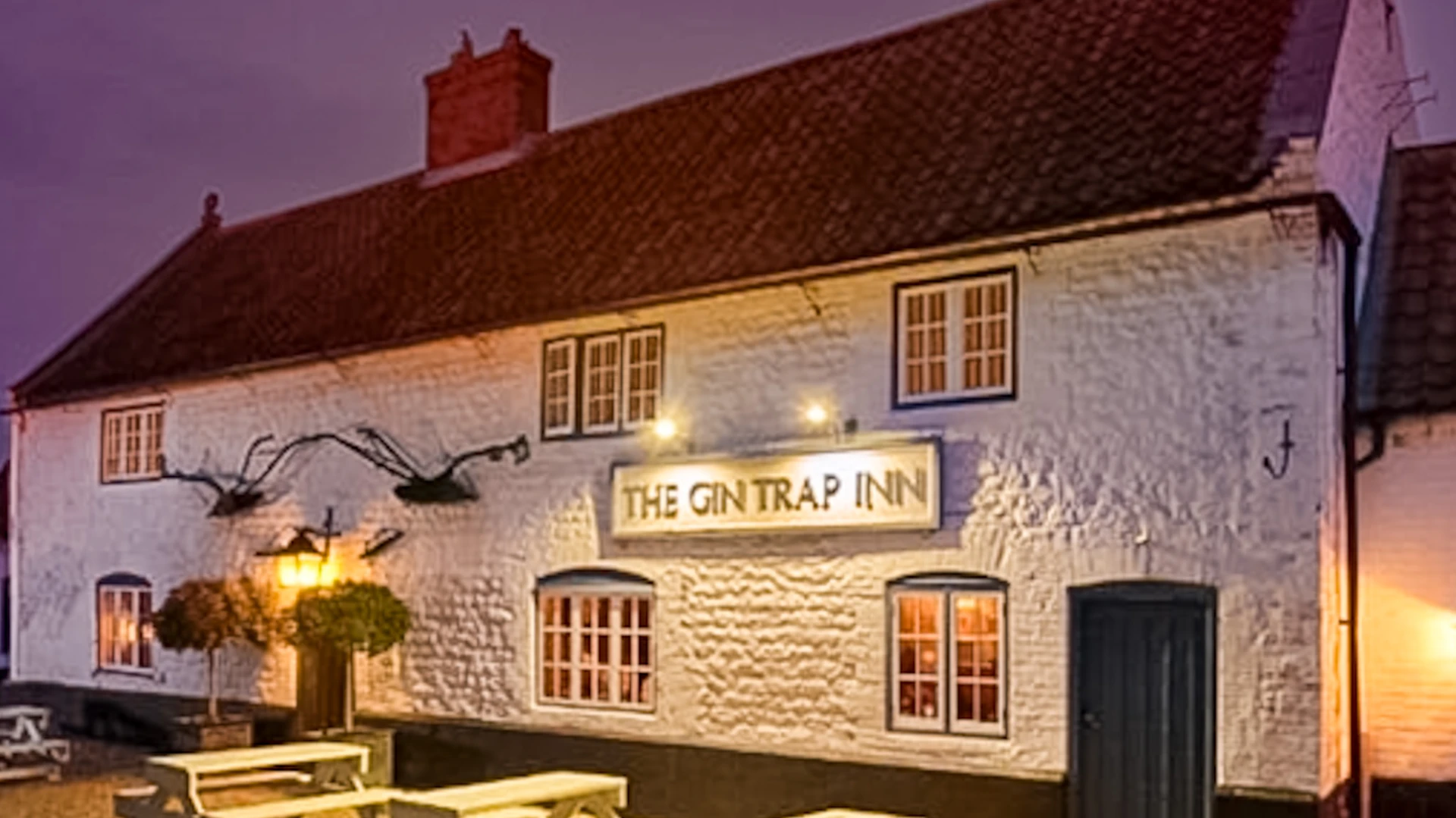 The Gin Trap Inn in Ringstead, North Norfolk, a traditional countryside inn near the Peddars Way and Norfolk Coast Path, photographed at dusk.