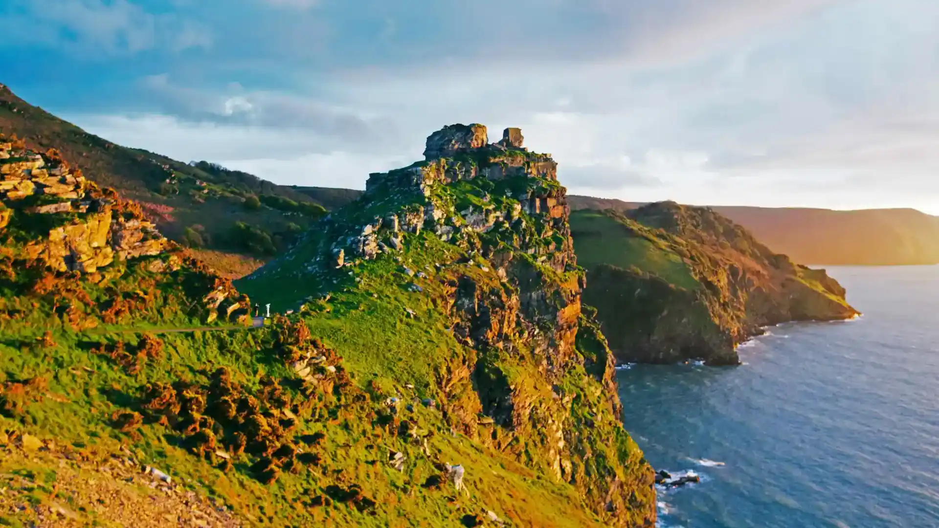 Rugged cliffs and rocky headland at Valley of the Rocks on the North Devon Coast, overlooking the sea at sunset.