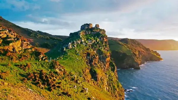 Rugged cliffs and rocky headland at Valley of the Rocks on the North Devon Coast, overlooking the sea at sunset.