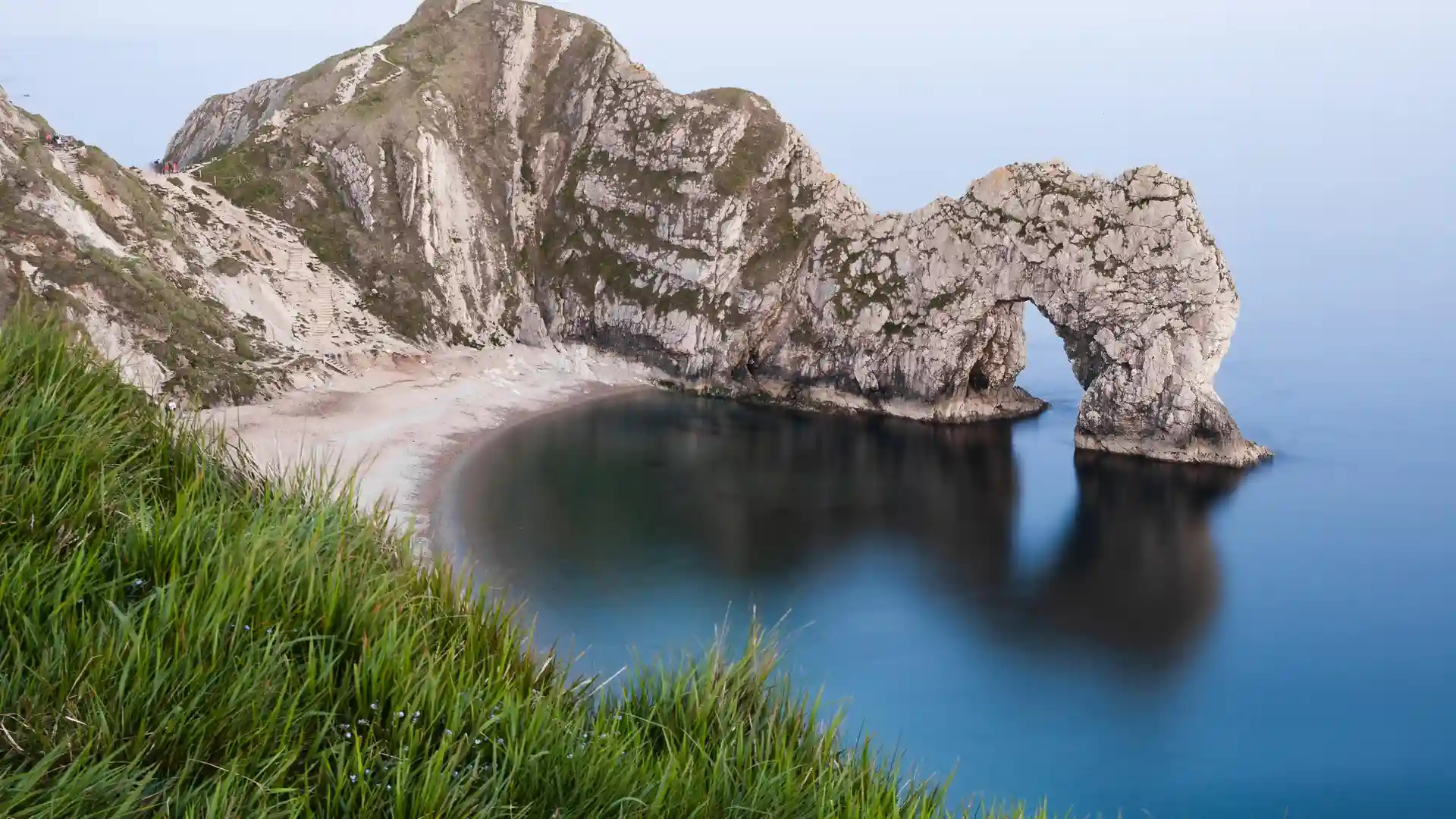 Durdle Door natural limestone arch on the Jurassic Coast in Dorset National Landscape, a famous landmark on the South West Coast Path.