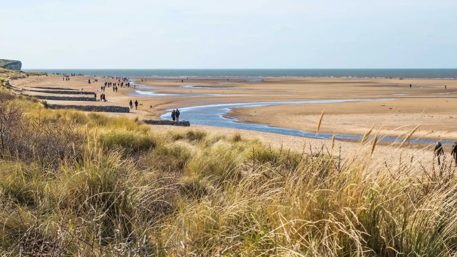 A view over Hunstanton beach on the North Norfolk coast taken from the sand dunes. Captured on a bright and sunny day in the winter.