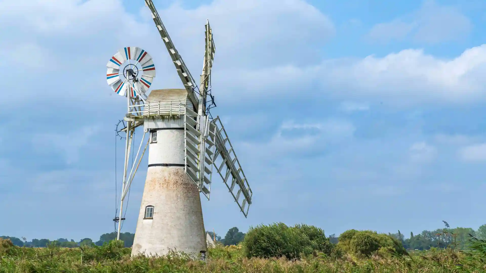 Traditional windpump beside marshland on the Weavers’ Way in the Norfolk Broads.
